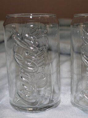 Vintage collectors set embossed Coca Cola glass set. Set of 7.